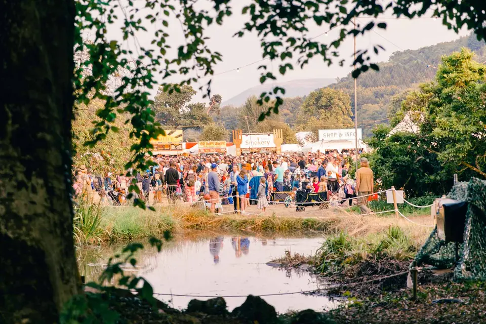 the pond at the rising stage with crowds beyond it