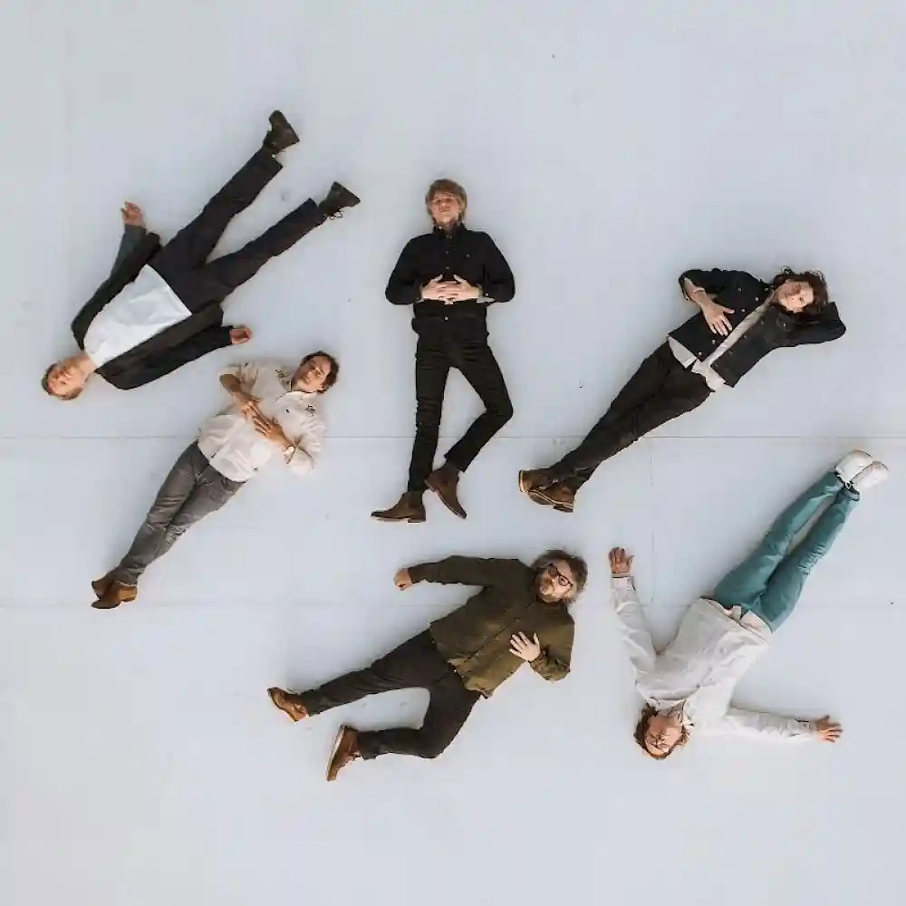 Members of Wilco lie on the floor