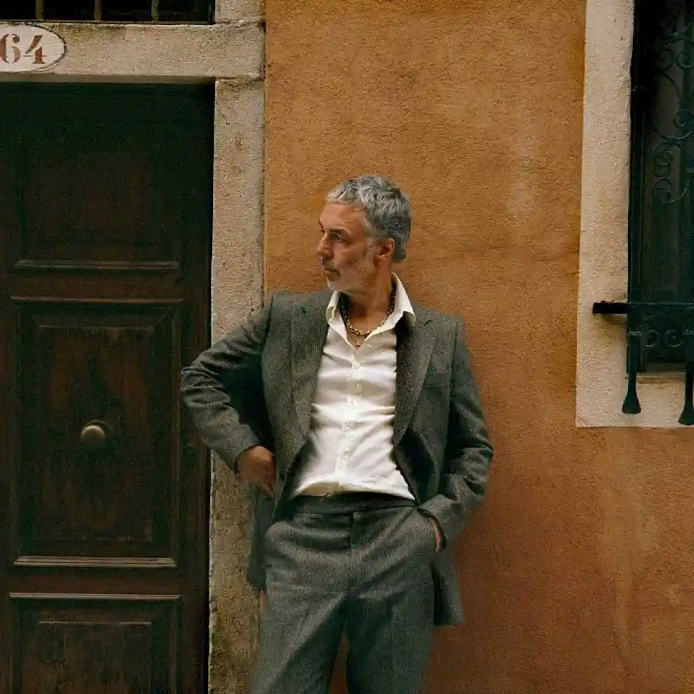 Baxter leaning on a wall