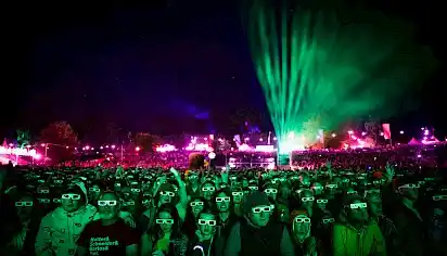 Looking back at the crowd wearing 3D glasses at the Mountain's Foot stage at night
