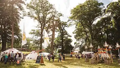 Nature Nurture field - there are yurts, tents and large festival flags