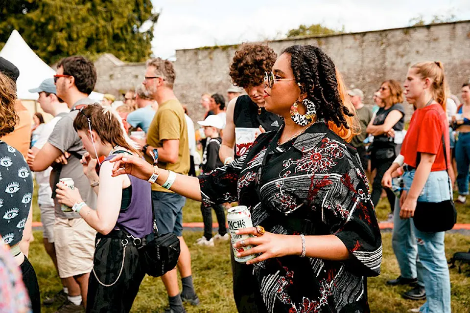 The crowd dance to the music in the walled garden