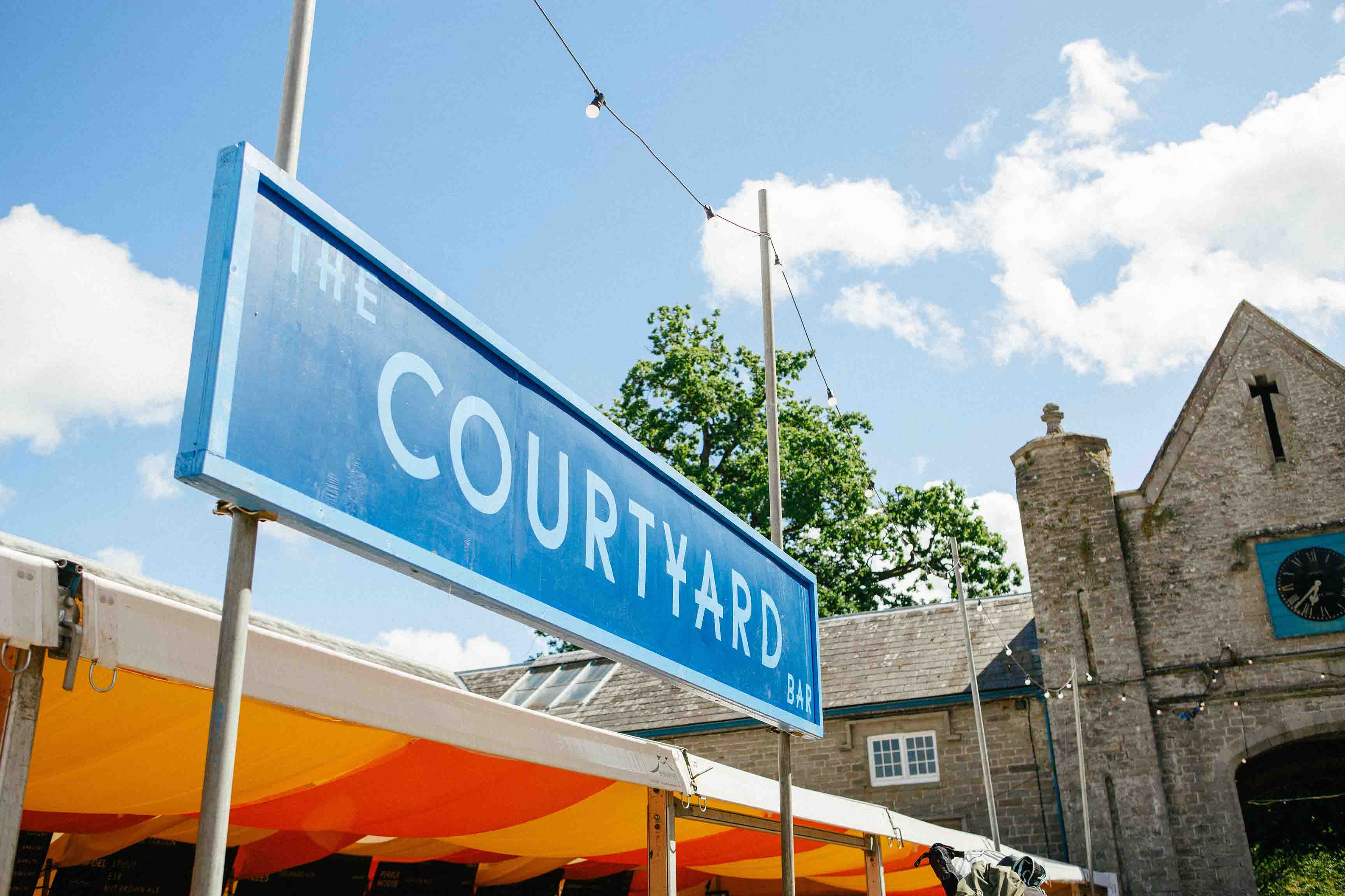 a sign reading the courtyard bar