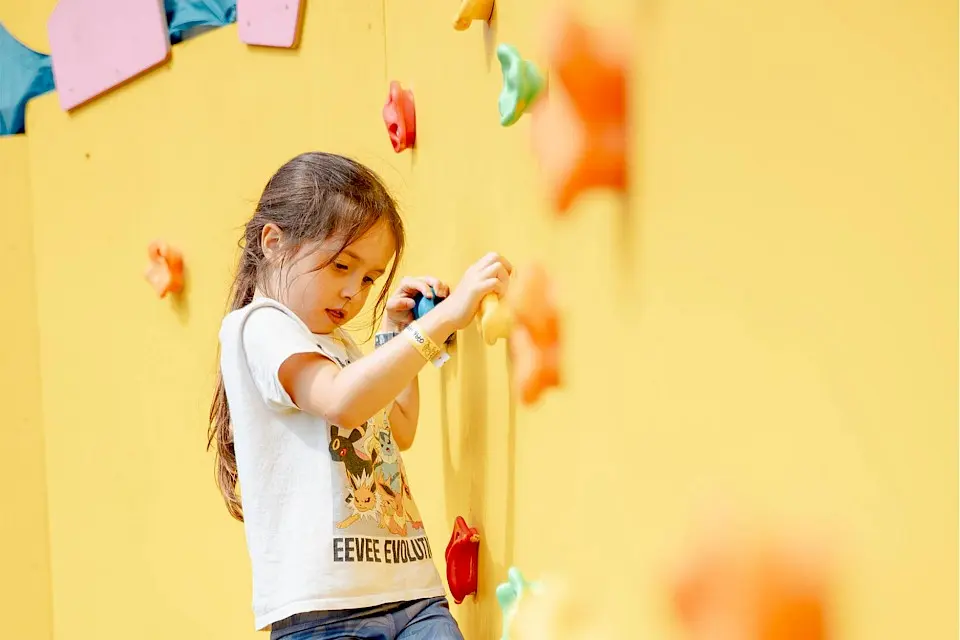 a girl on the rock climbing wall