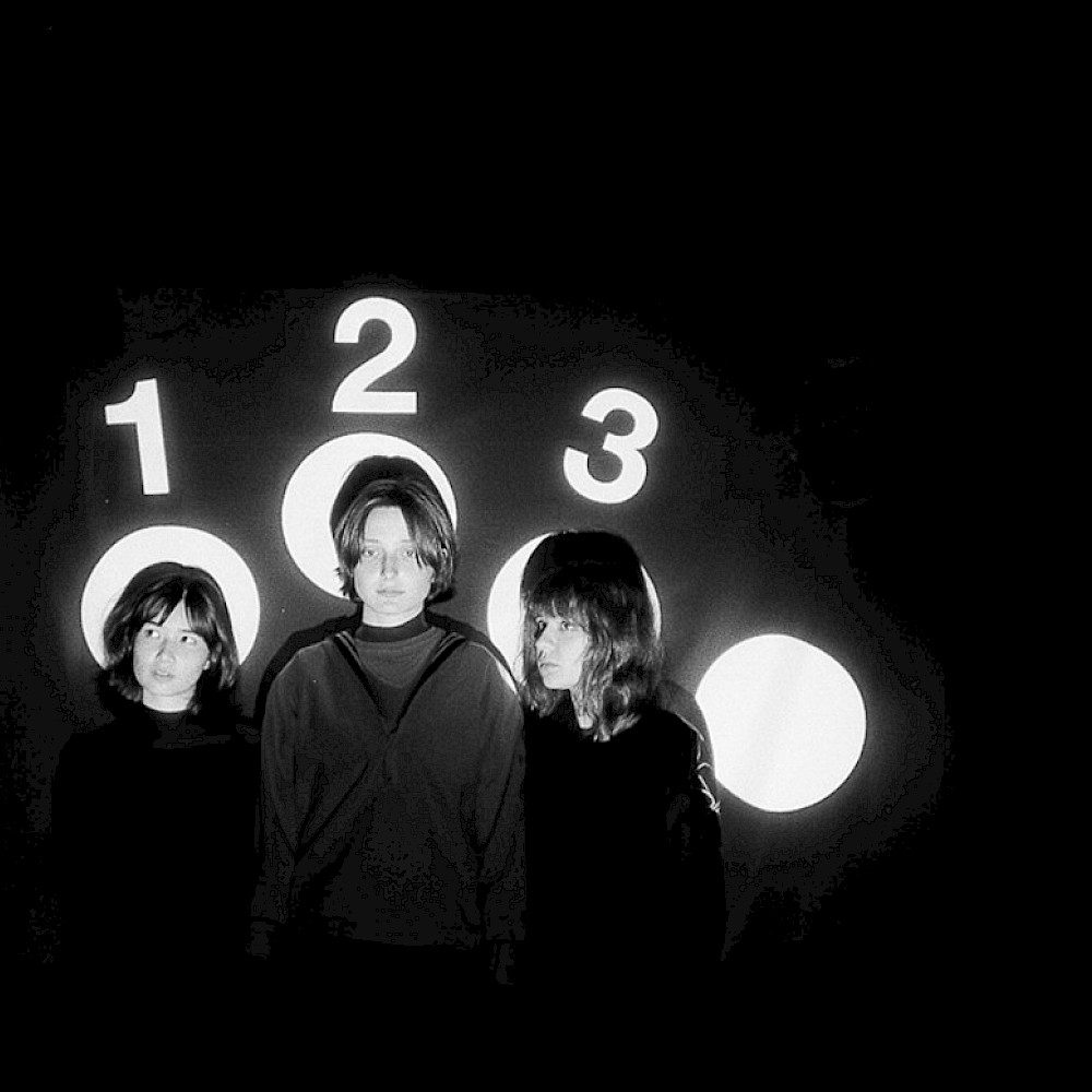 Horsegirl band with 1, 2, and 3 spotlights on them