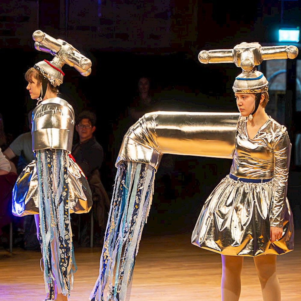 Two women dressed as taps