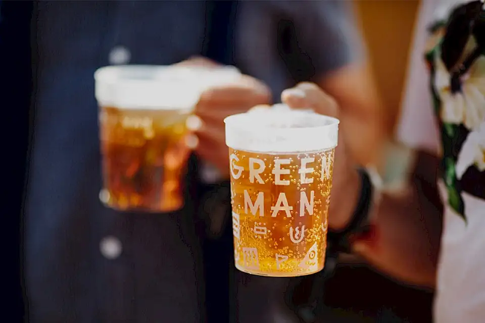 Two pints of Green Man's signature Growler in two Green Man cups